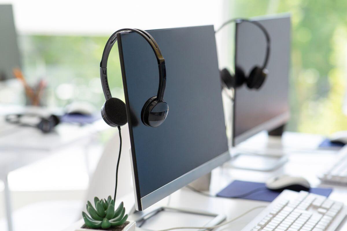 Headset sitting on top of a monitor