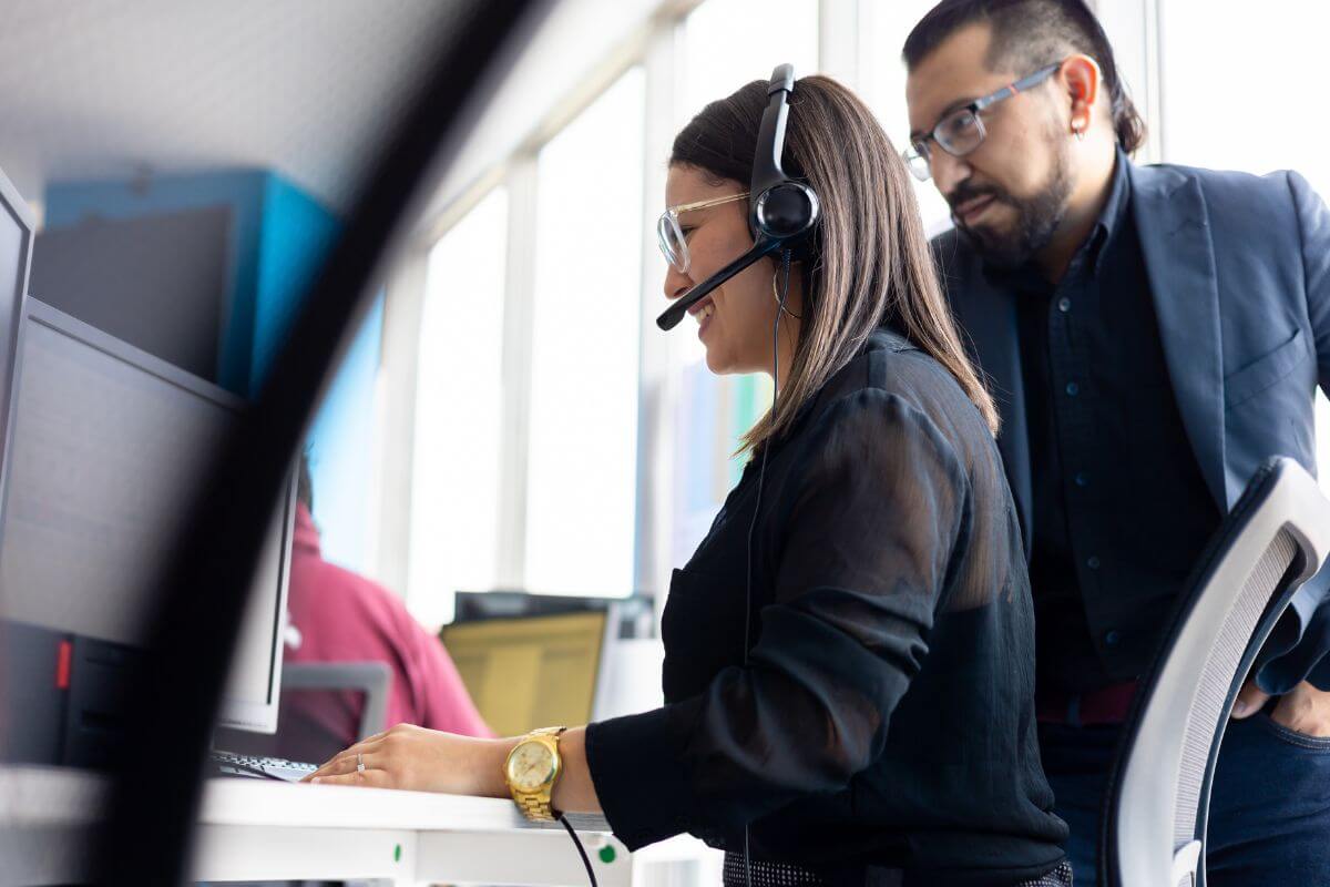 Girl with a coach during a call training session