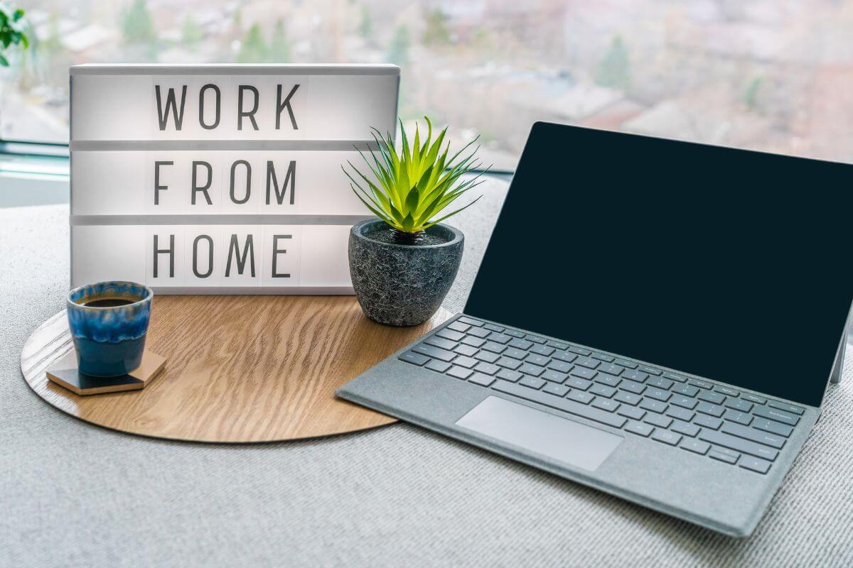 laptop in a table with a work Work From Home