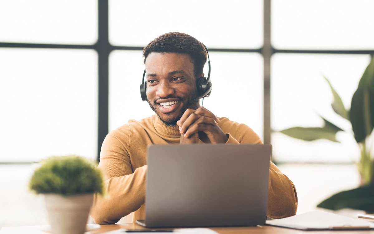 customer service representative in front of a laptop