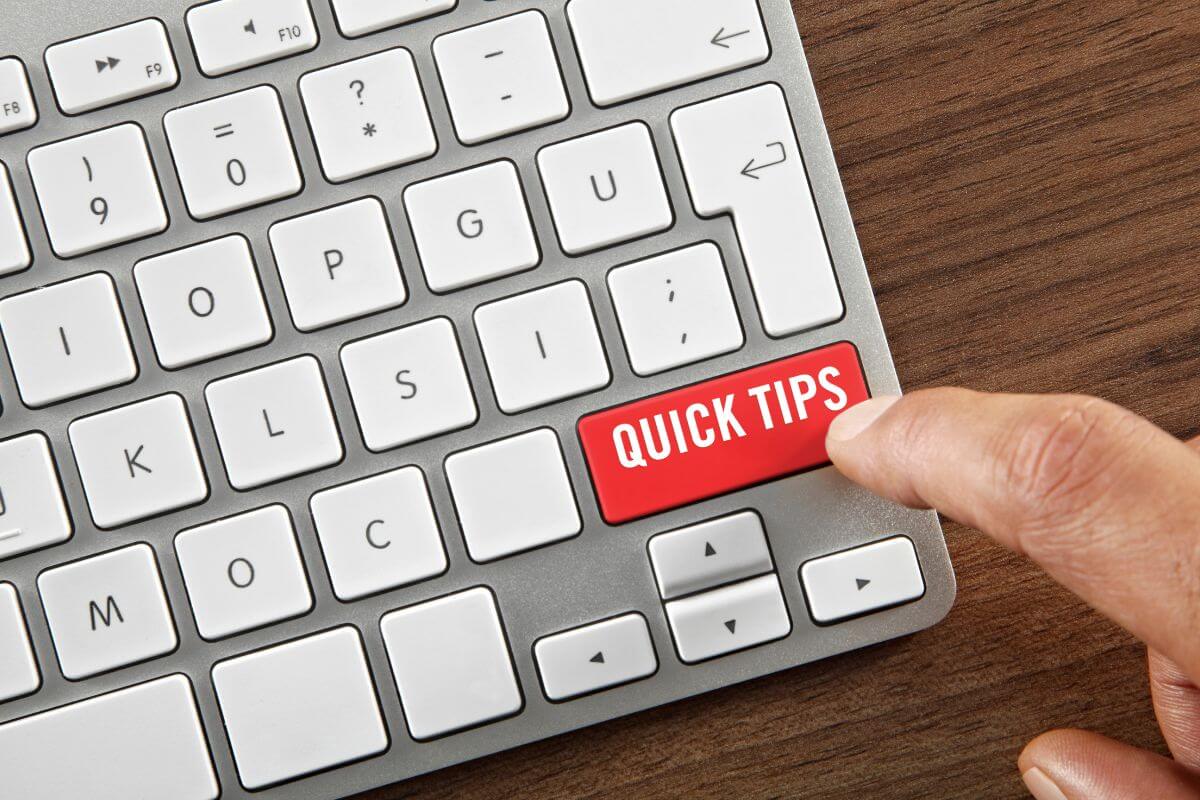 laptop keyboard with a red key and the word QUICK TIPS